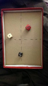 My divination dice, and the 'board' made from a shoe box lid.